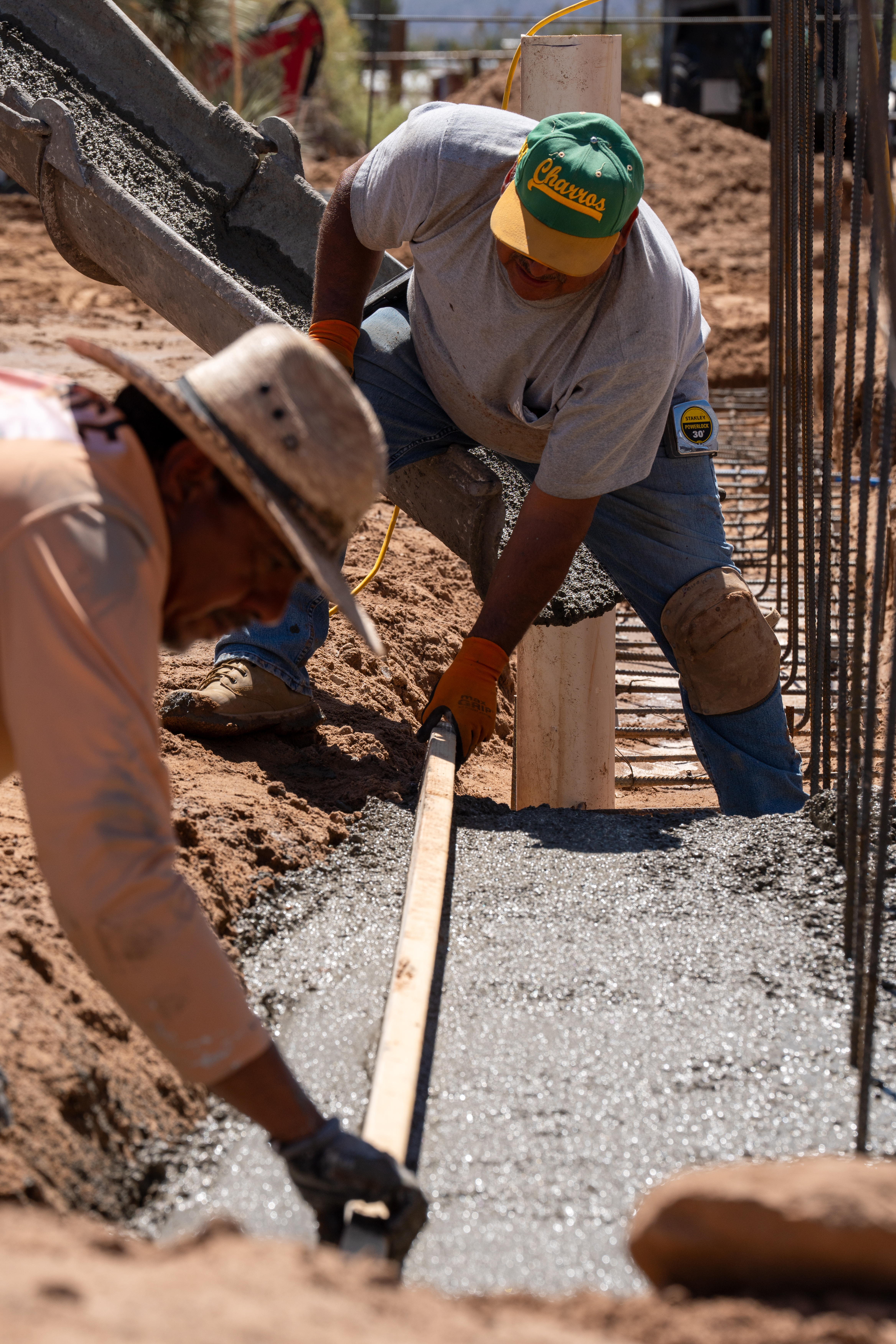 Placing concrete in foundation forms